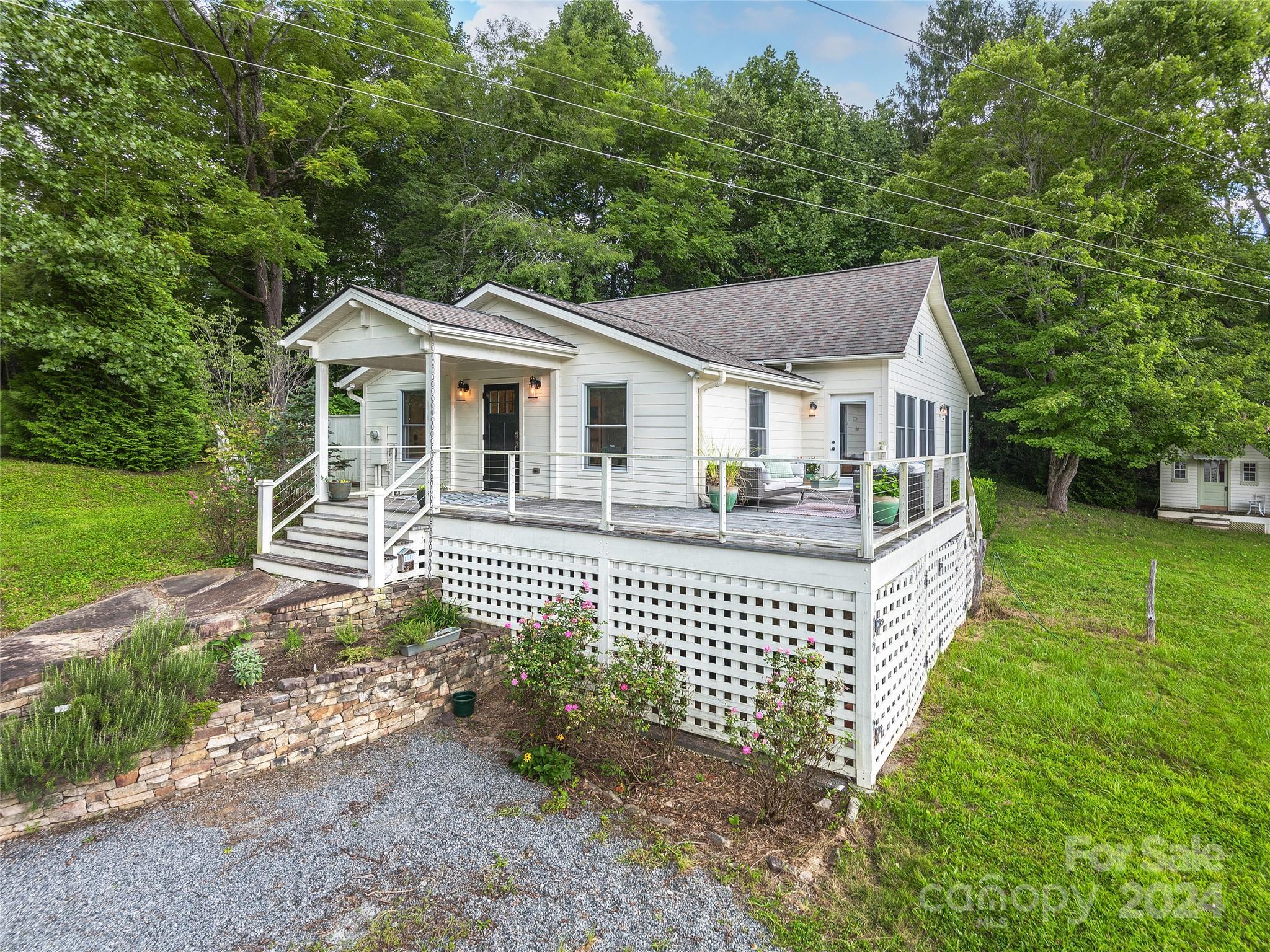 2560 King Road Pisgah Forest, NC 28768 - Photo 19 of 44 a front view of a house with garden