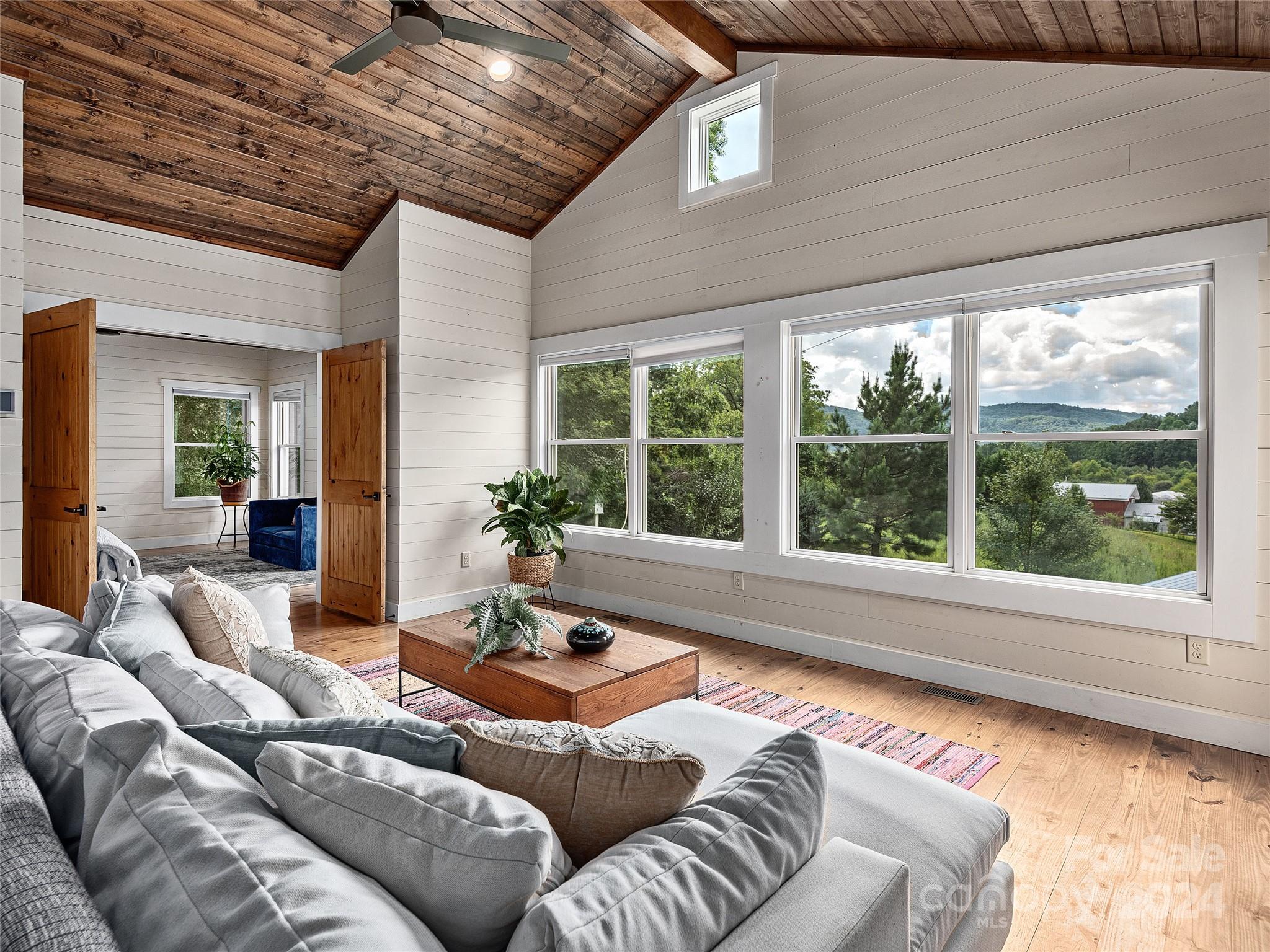 2560 King Road Pisgah Forest, NC 28768 - Photo 25 of 44 a living room with furniture and a large window
