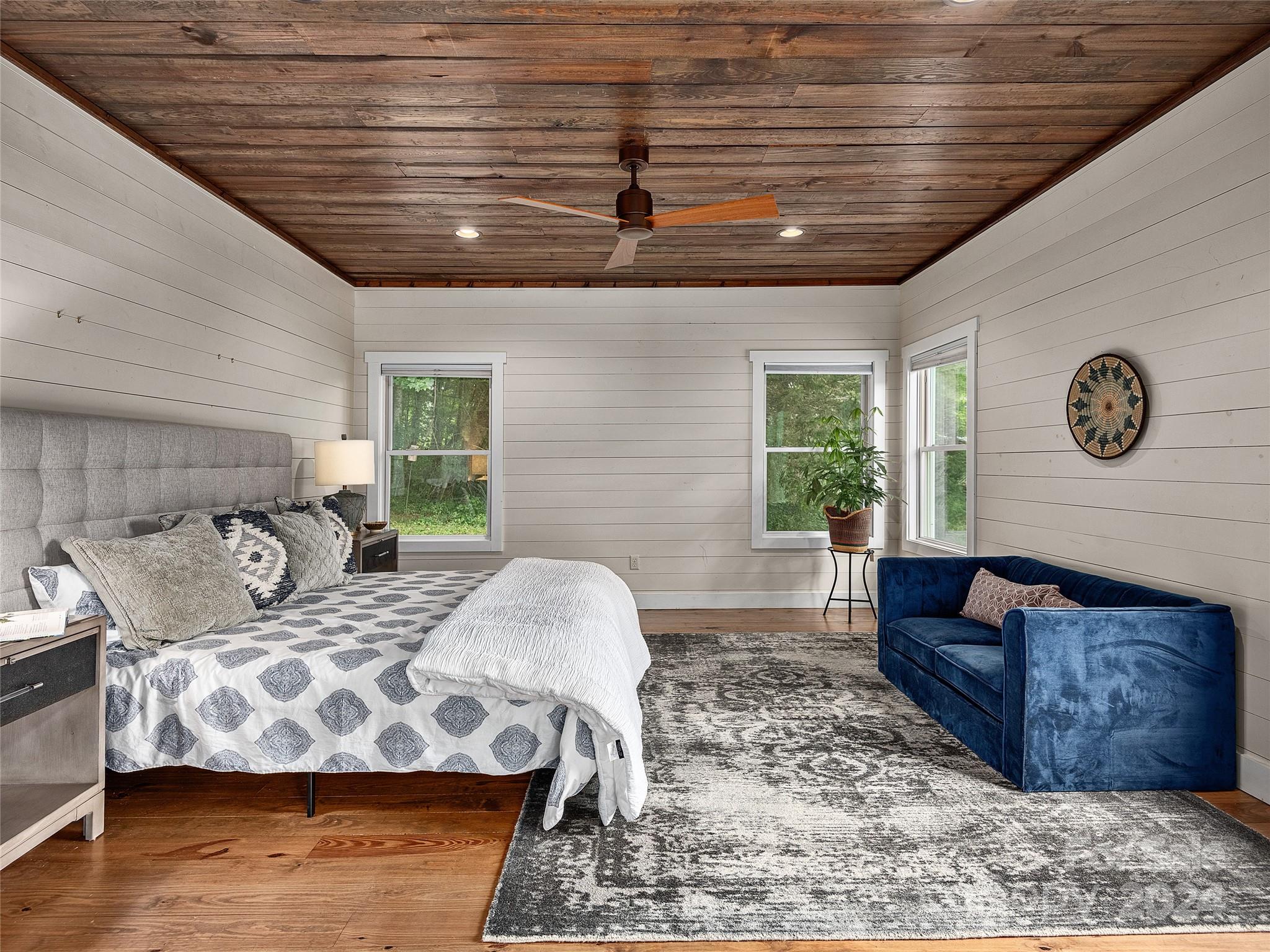 2560 King Road Pisgah Forest, NC 28768 - Photo 26 of 44 a bedroom with furniture and a large window