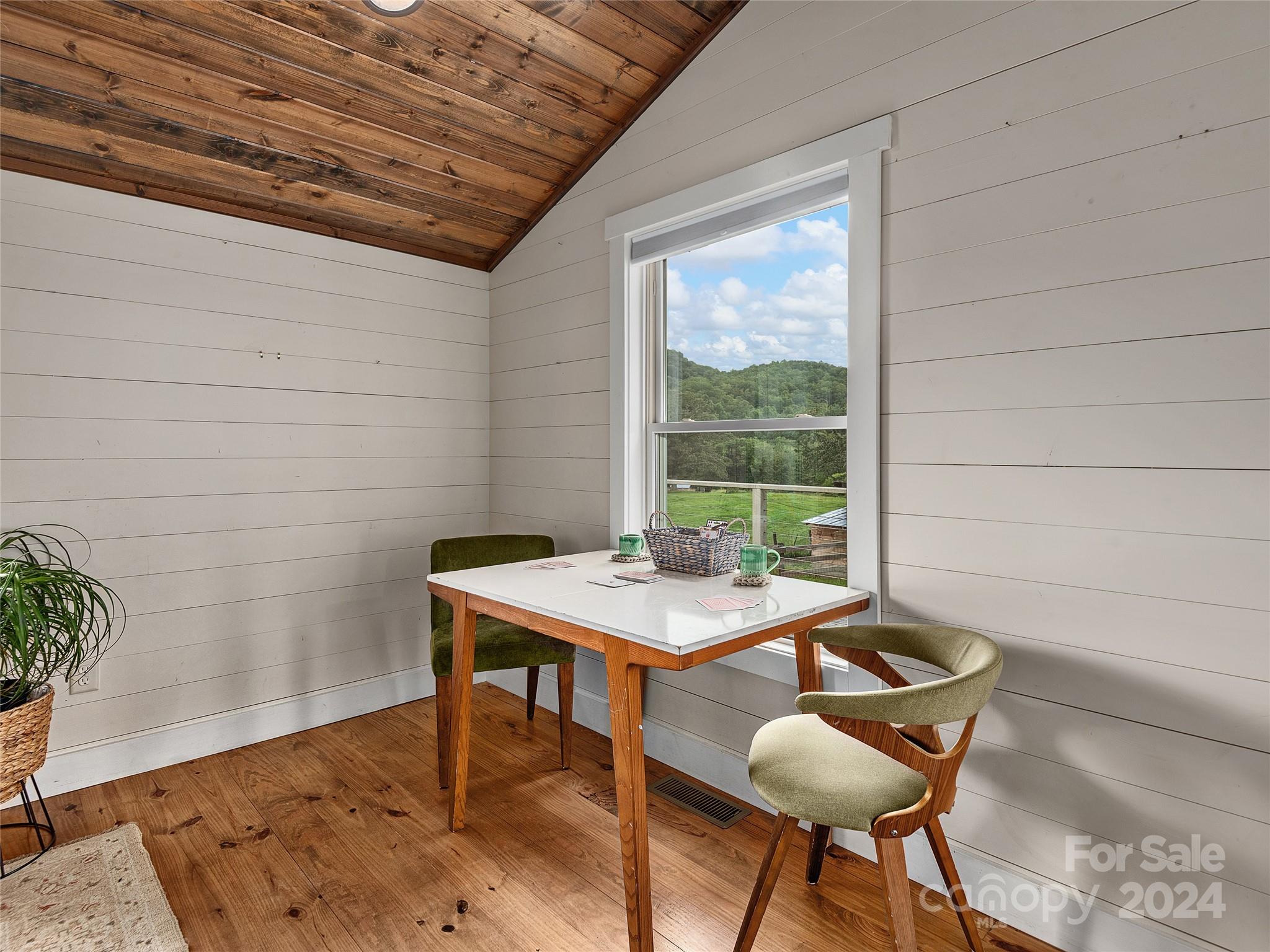 2560 King Road Pisgah Forest, NC 28768 - Photo 30 of 44 a view of a dining room with furniture and wooden floor