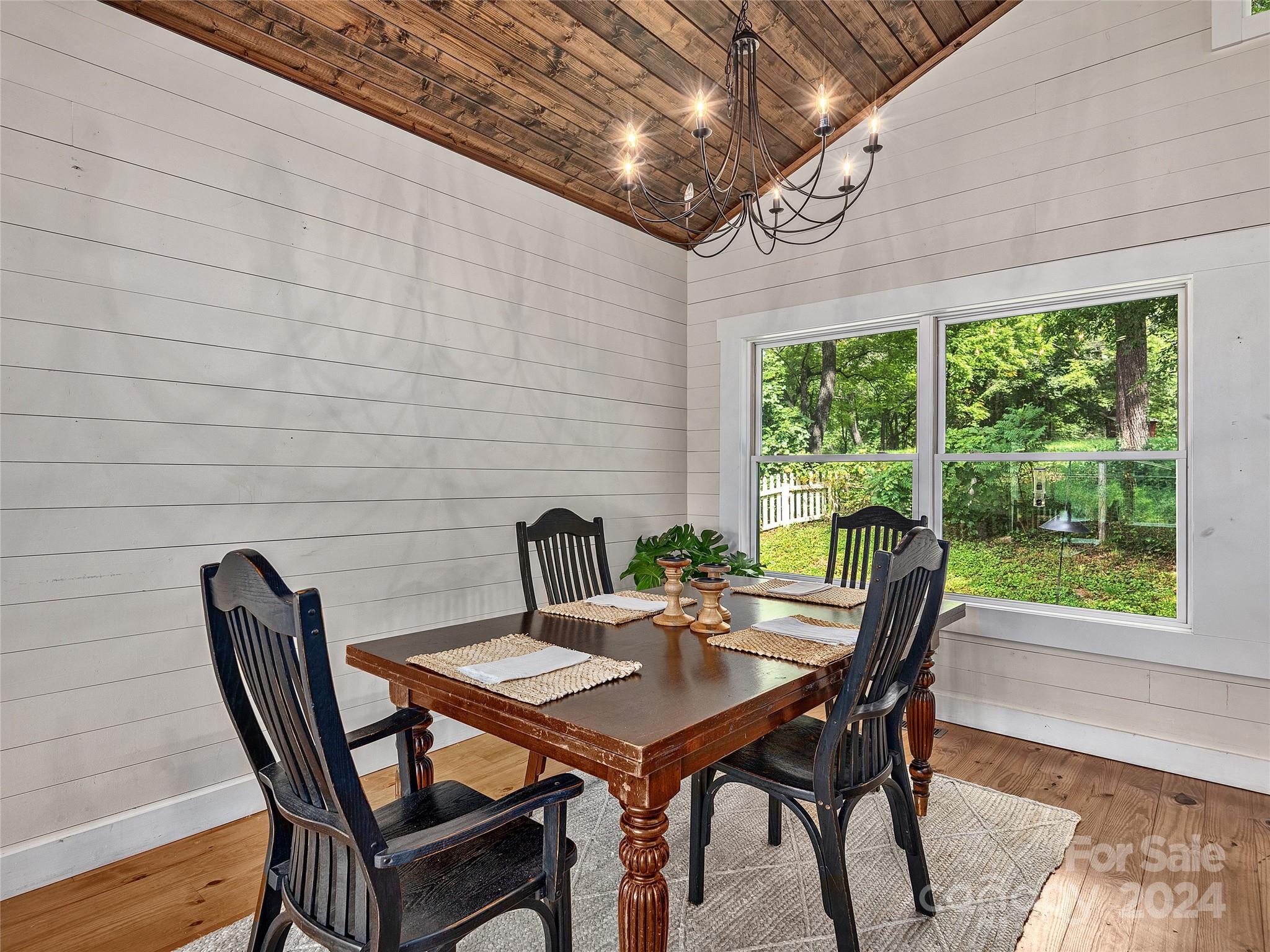 2560 King Road Pisgah Forest, NC 28768 - Photo 33 of 44 a view of a dining room with furniture window and wooden floor