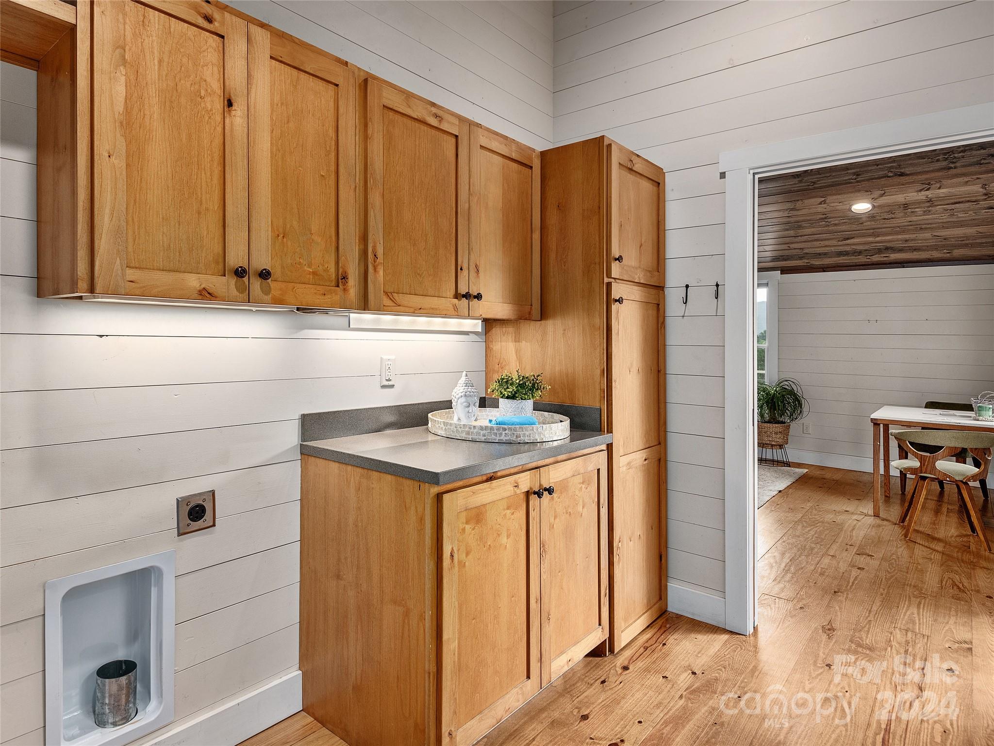 2560 King Road Pisgah Forest, NC 28768 - Photo 34 of 44 a kitchen with stainless steel appliances a sink cabinets and a table
