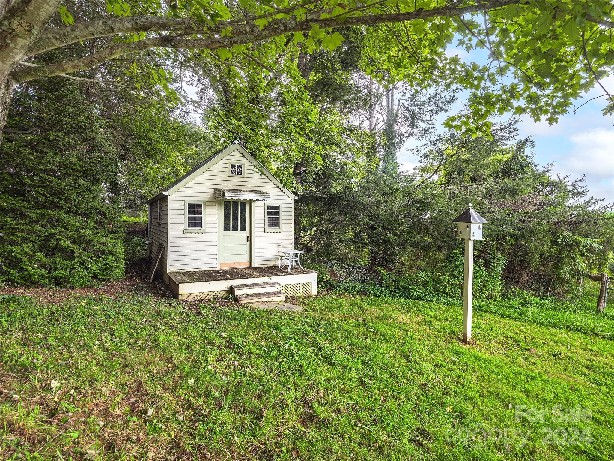 2560 King Road Pisgah Forest, NC 28768 - Photo 35 of 44 a front view of a house with a yard