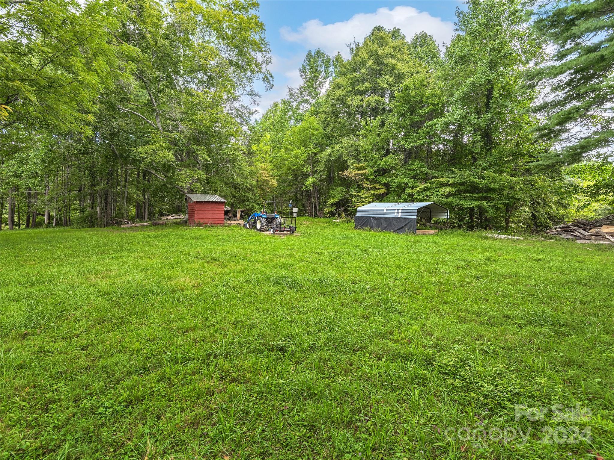 2560 King Road Pisgah Forest, NC 28768 - Photo 37 of 44 a view of a field of grass and trees
