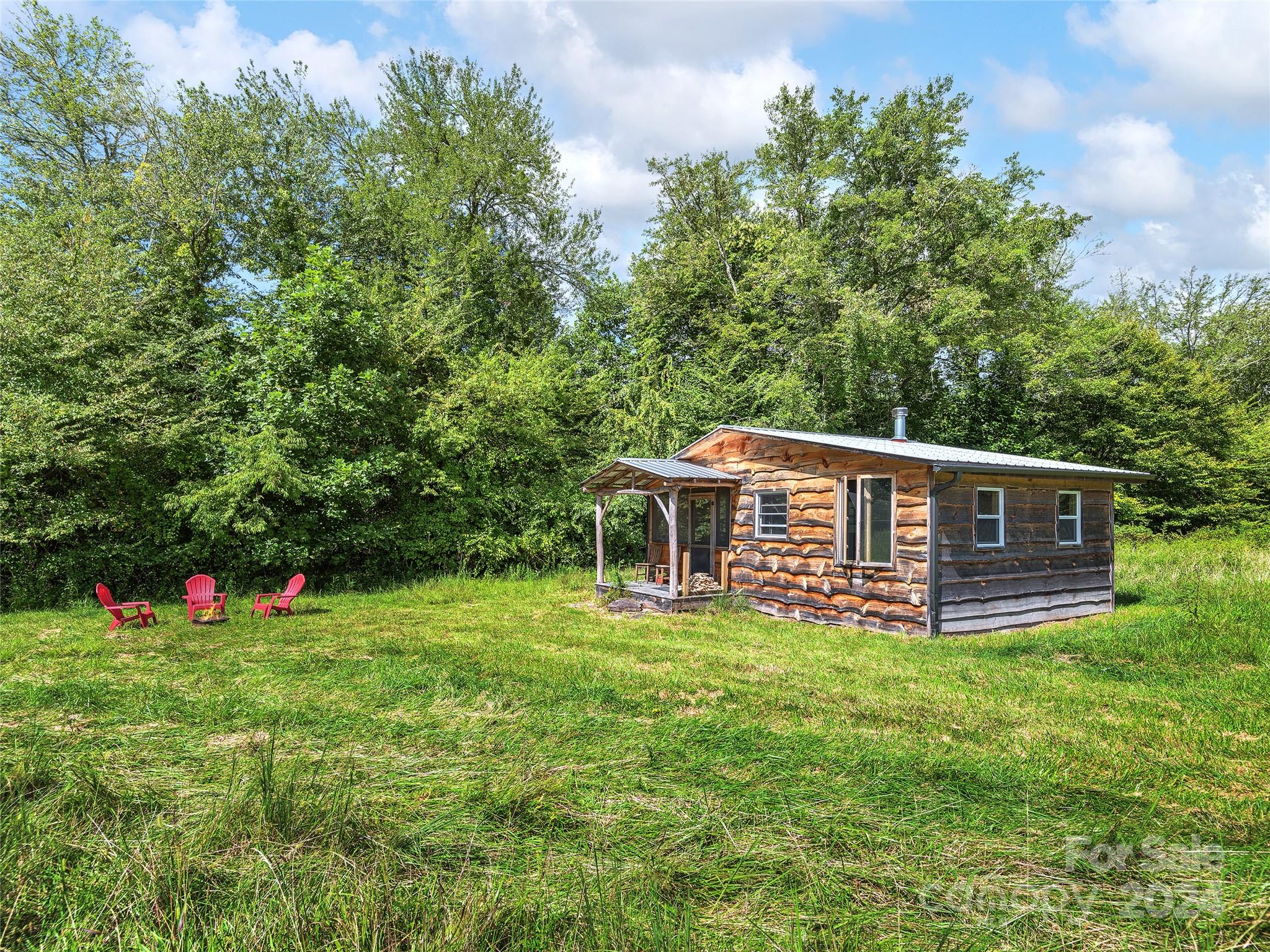 2560 King Road Pisgah Forest, NC 28768 - Photo 39 of 44 a view of a house with a yard and sitting area