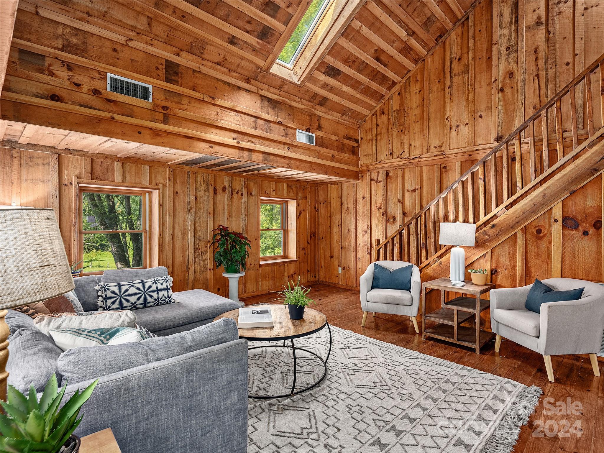 2560 King Road Pisgah Forest, NC 28768 - Photo 6 of 44 a living room with furniture and a large window