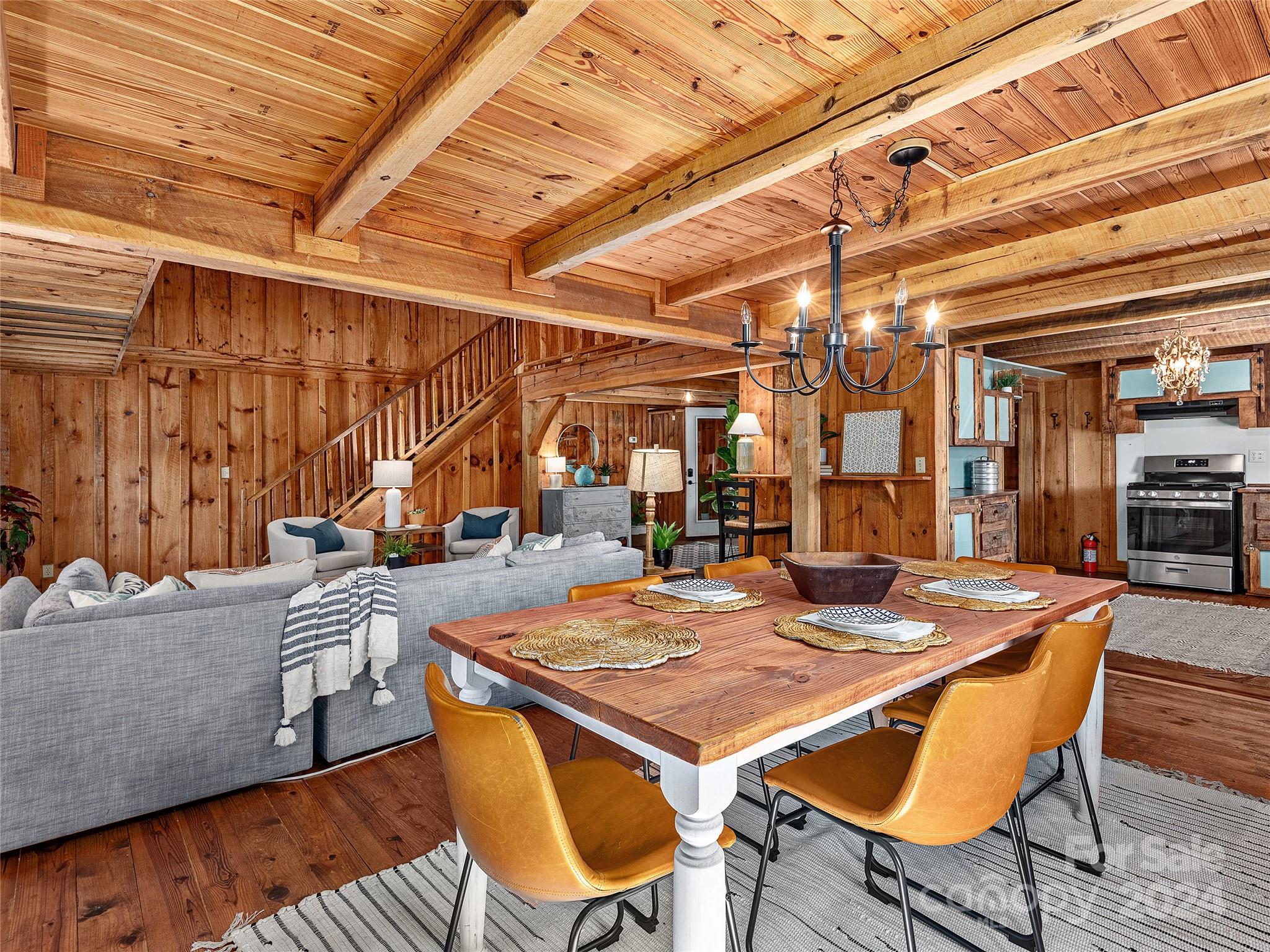 2560 King Road Pisgah Forest, NC 28768 - Photo 9 of 44 a view of a dining room with furniture and wooden floor