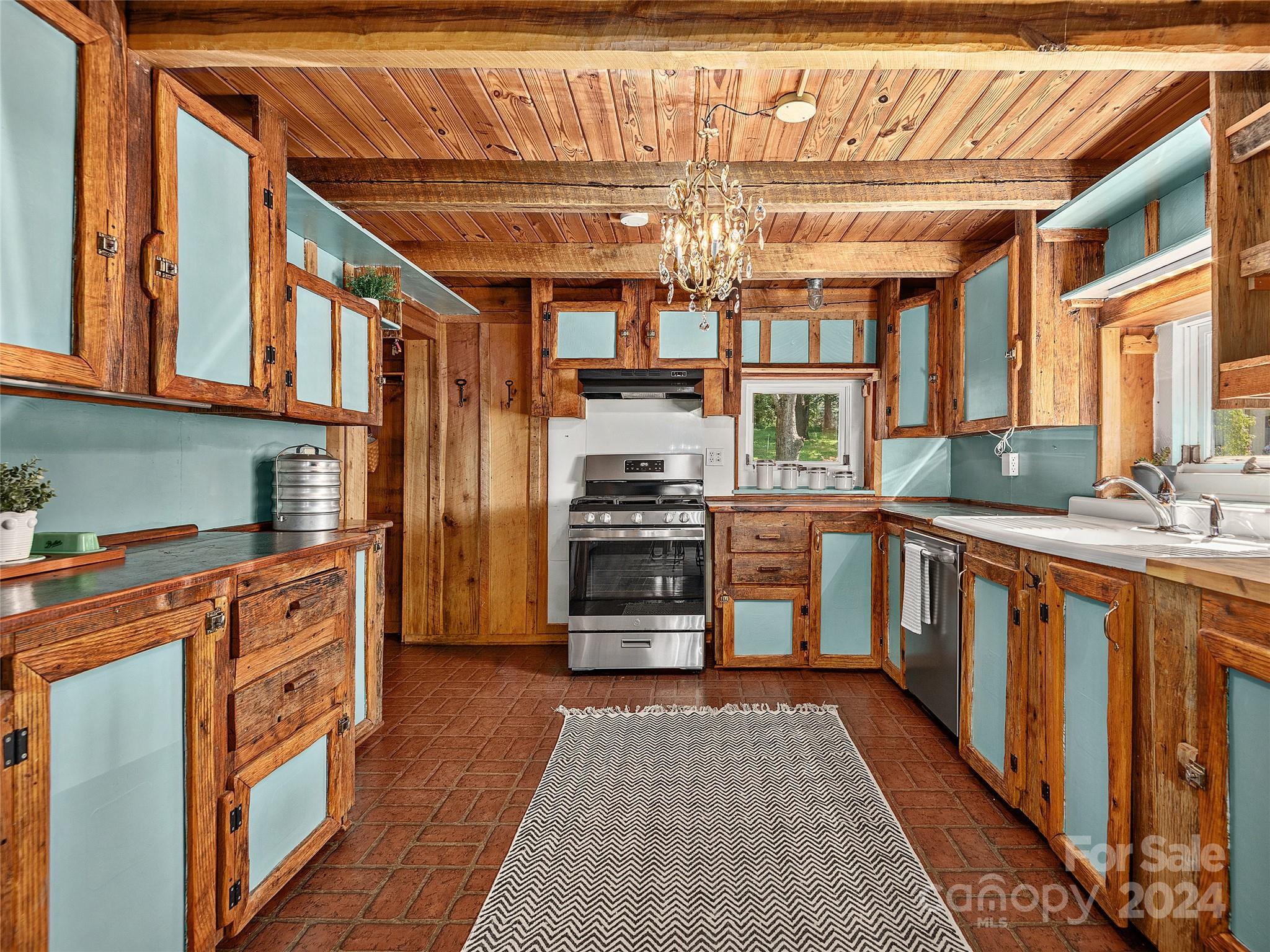 2560 King Road Pisgah Forest, NC 28768 - Photo 10 of 44 a kitchen with stainless steel appliances granite countertop a stove and cabinets