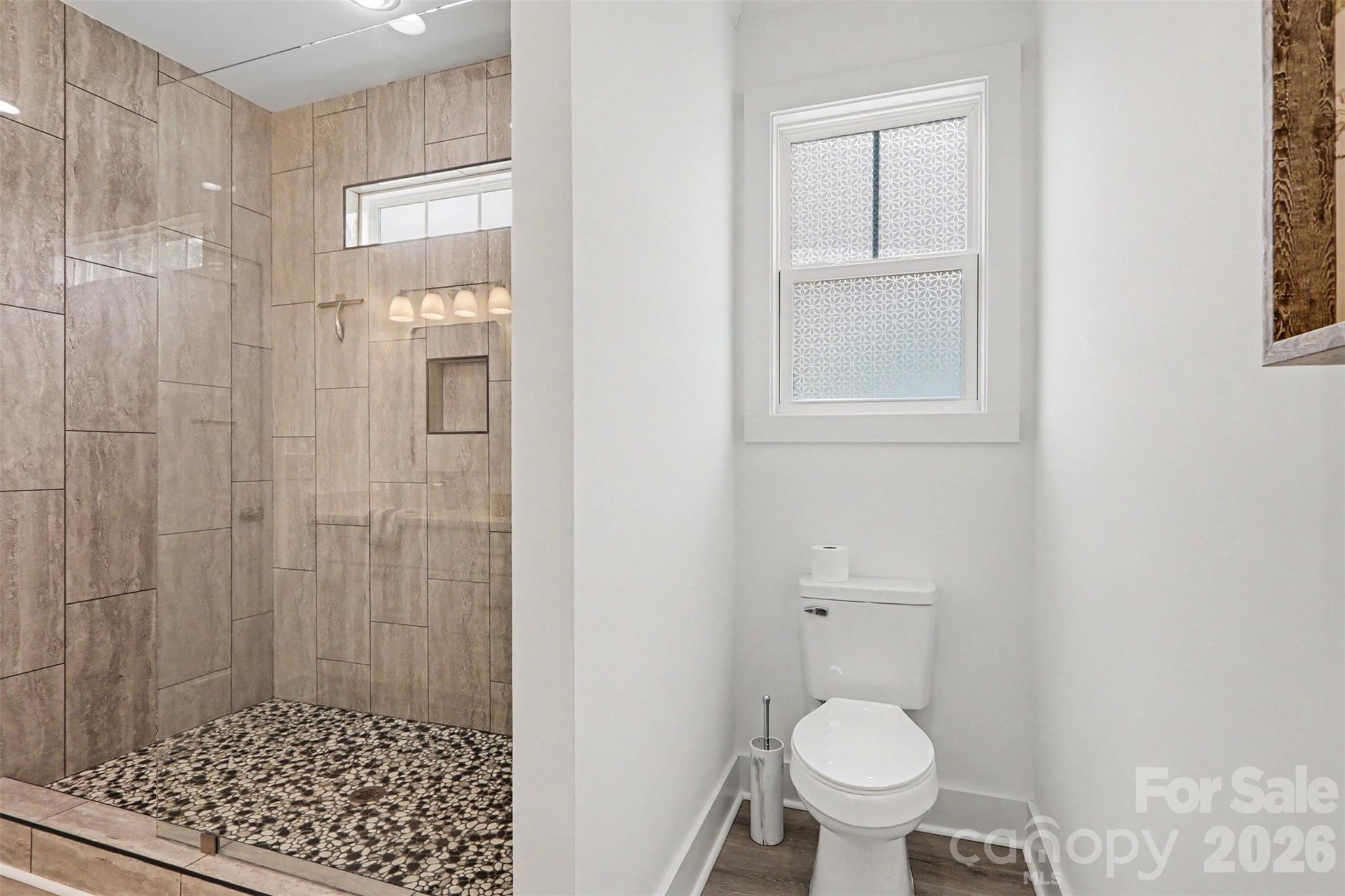 4115 Miller Road Salisbury, NC 28147 - Photo 17 of 26 a bathroom with a toilet and a shower