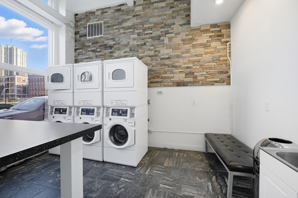 11-31 Park Street, Unit 302 Springfield, MA 01103 - Photo 2 of 3 a utility room with dryer and washer