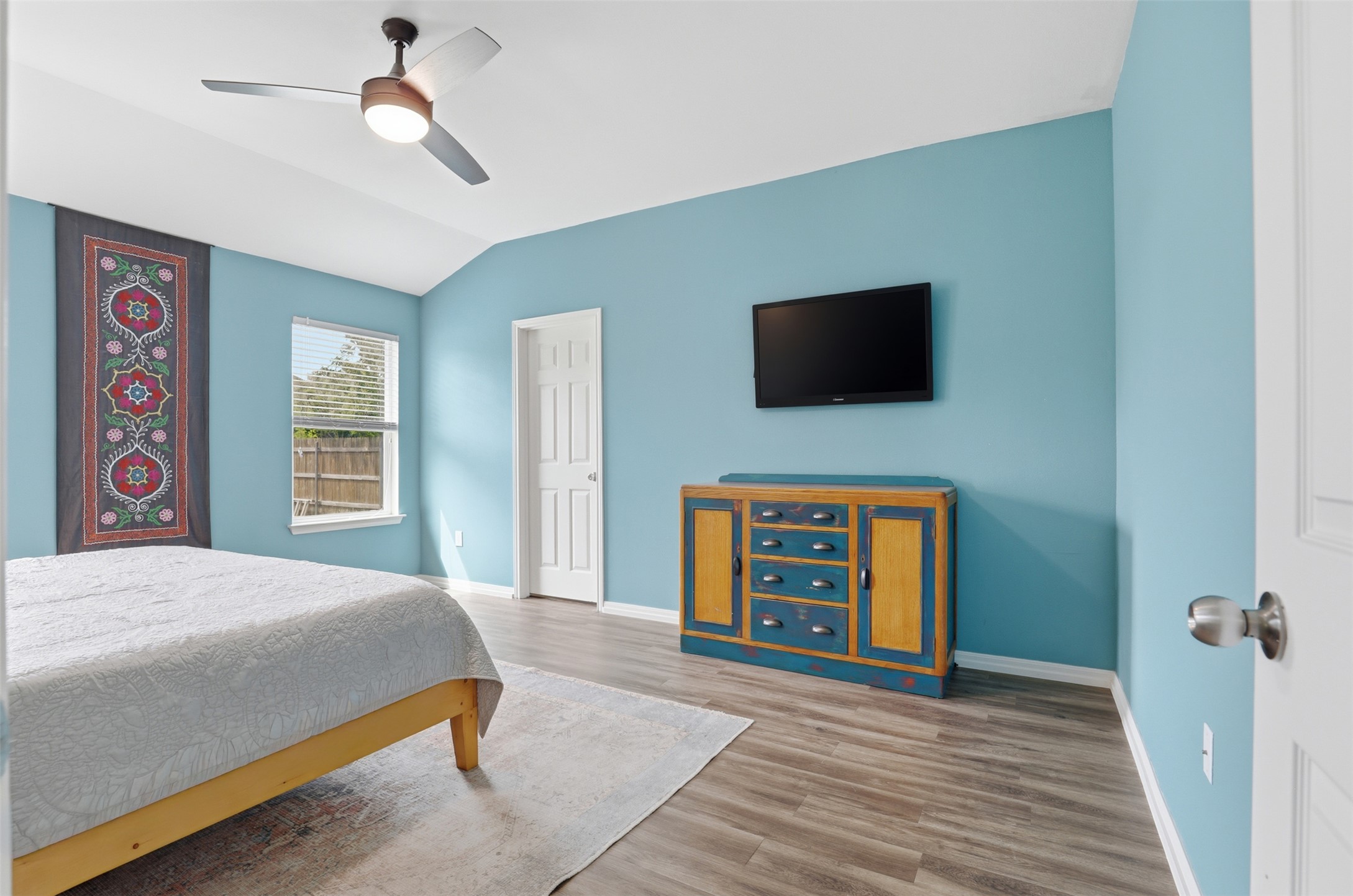 13804 Sierra Wind Lane Elgin, TX 78621 - Photo 12 of 29 a bedroom with a bed and a flat screen tv