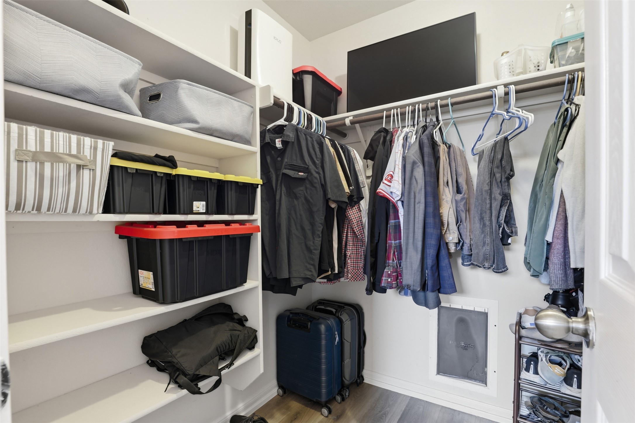 13804 Sierra Wind Lane Elgin, TX 78621 - Photo 14 of 29 a view of walk in closet with clothes and shoes