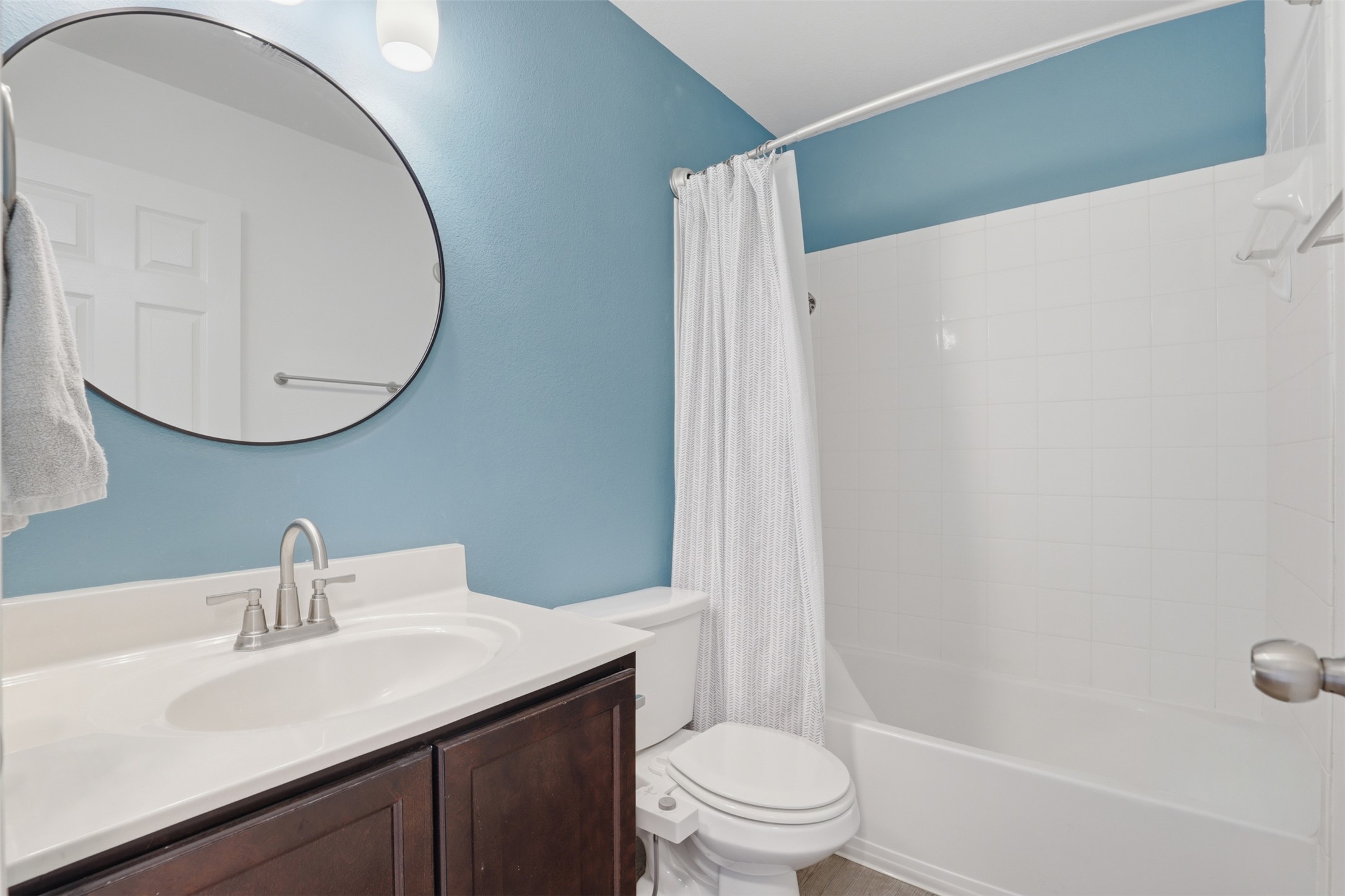 13804 Sierra Wind Lane Elgin, TX 78621 - Photo 15 of 29 a bathroom with a sink a toilet and a mirror