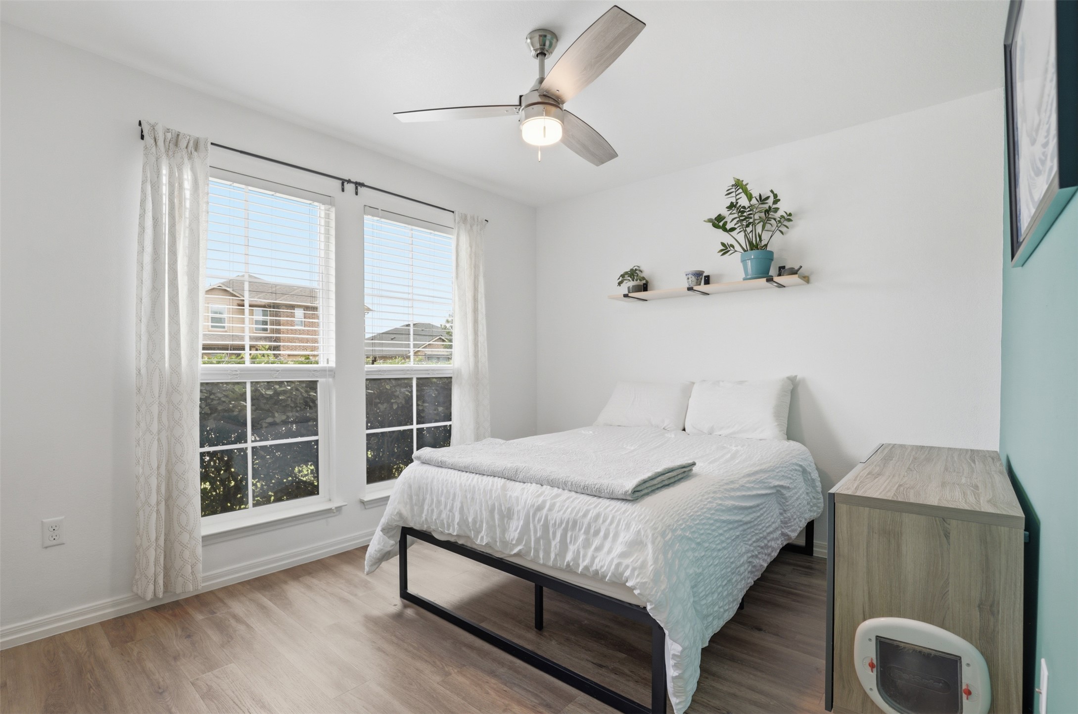 13804 Sierra Wind Lane Elgin, TX 78621 - Photo 20 of 29 a bedroom with a large bed and a window