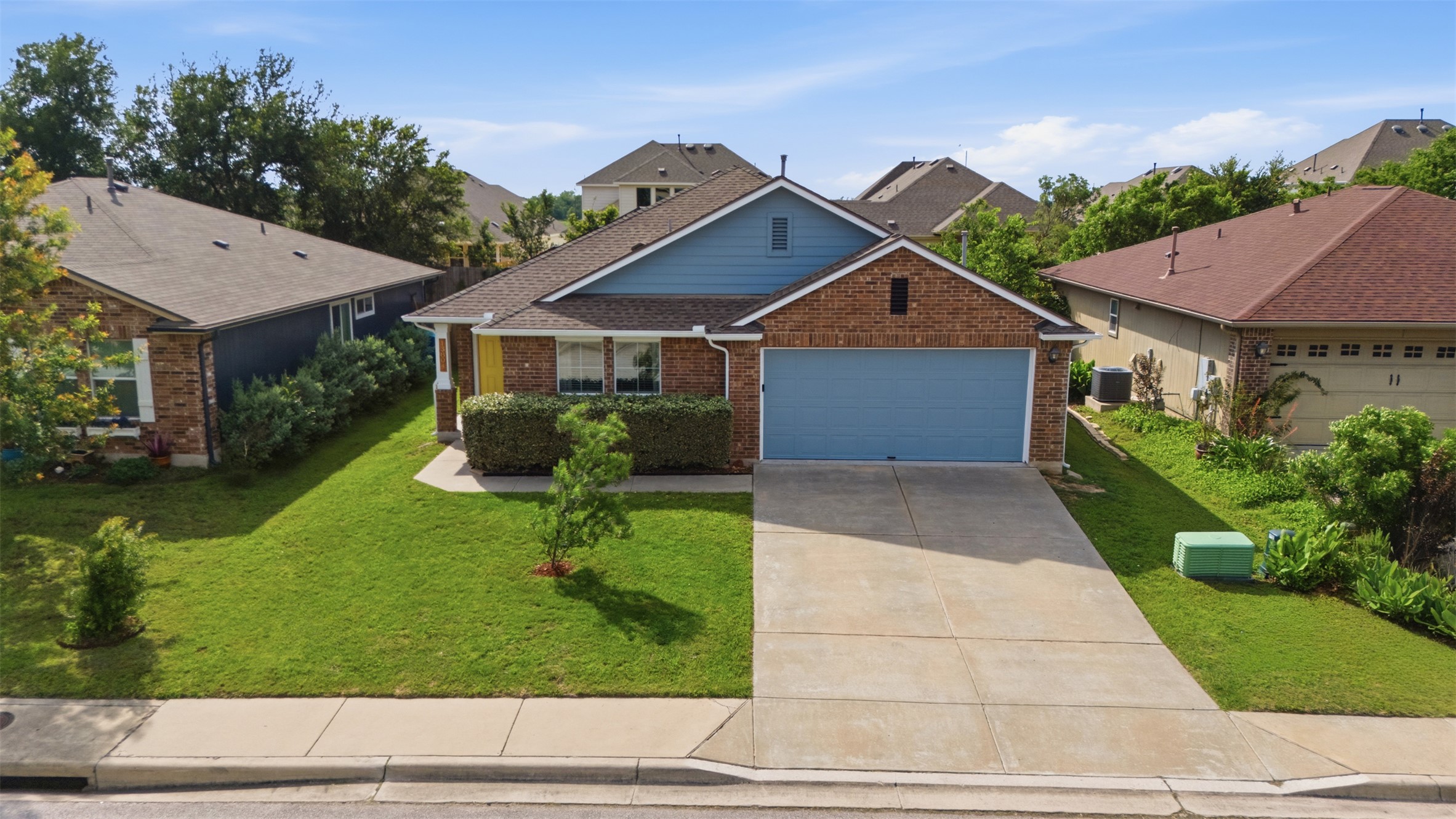 13804 Sierra Wind Lane Elgin, TX 78621 - Photo 24 of 29 a front view of a house with garden
