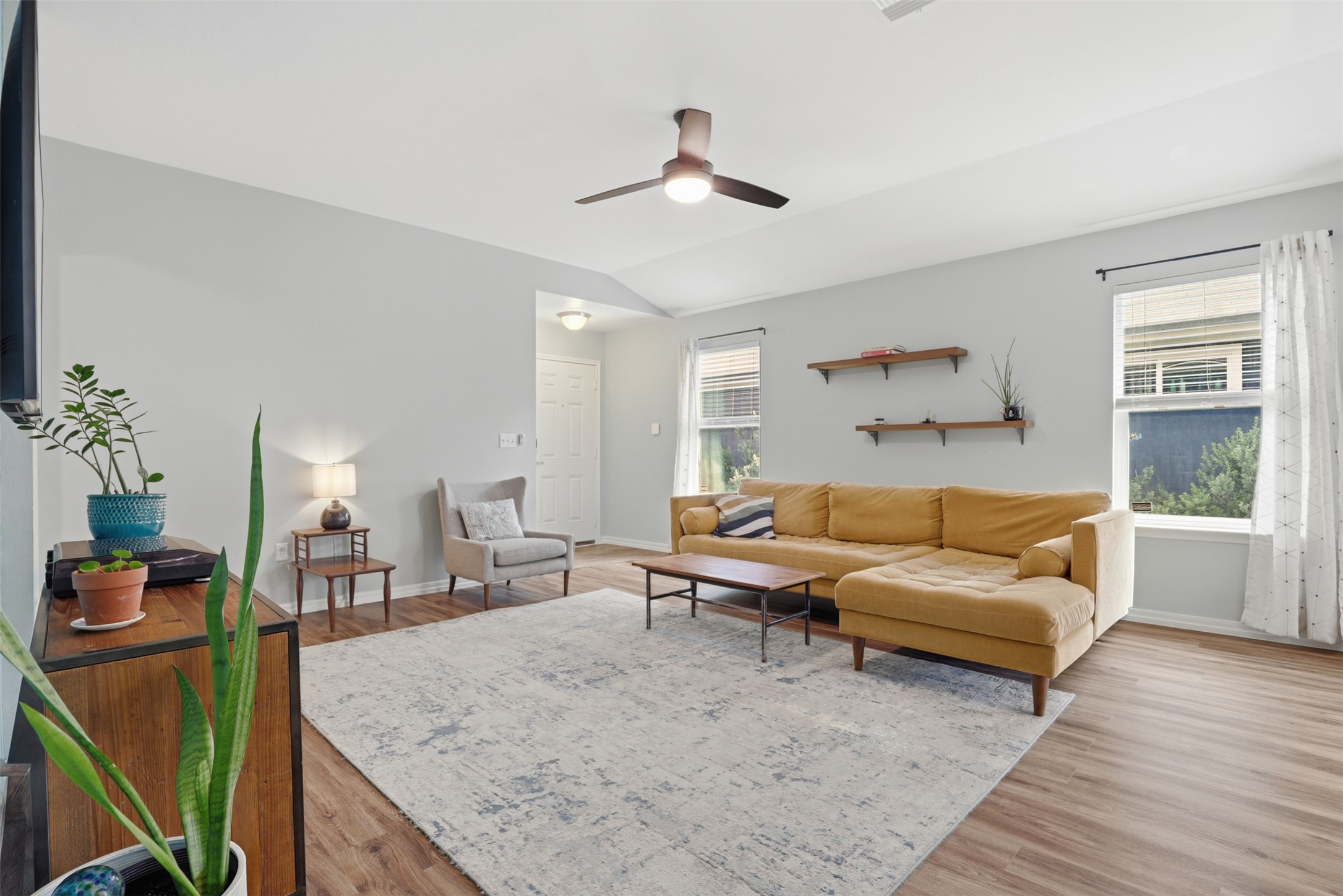 13804 Sierra Wind Lane Elgin, TX 78621 - Photo 5 of 29 a living room with furniture and a wooden floor