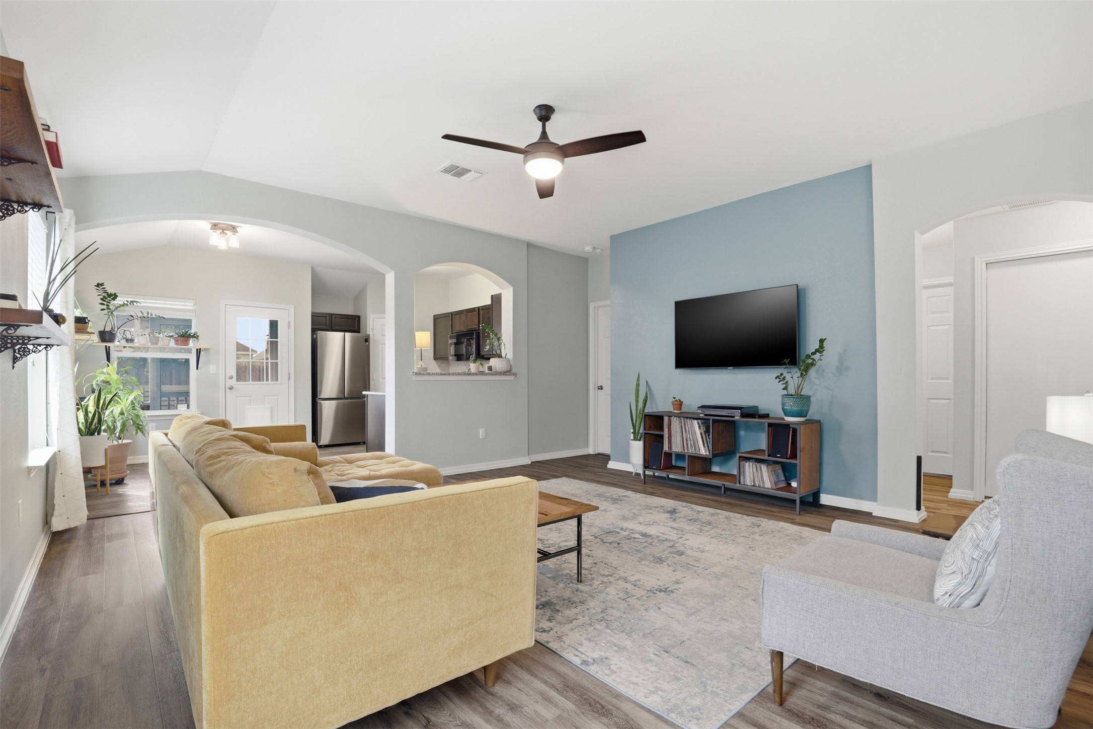 13804 Sierra Wind Lane Elgin, TX 78621 - Photo 6 of 29 a living room with furniture and a flat screen tv
