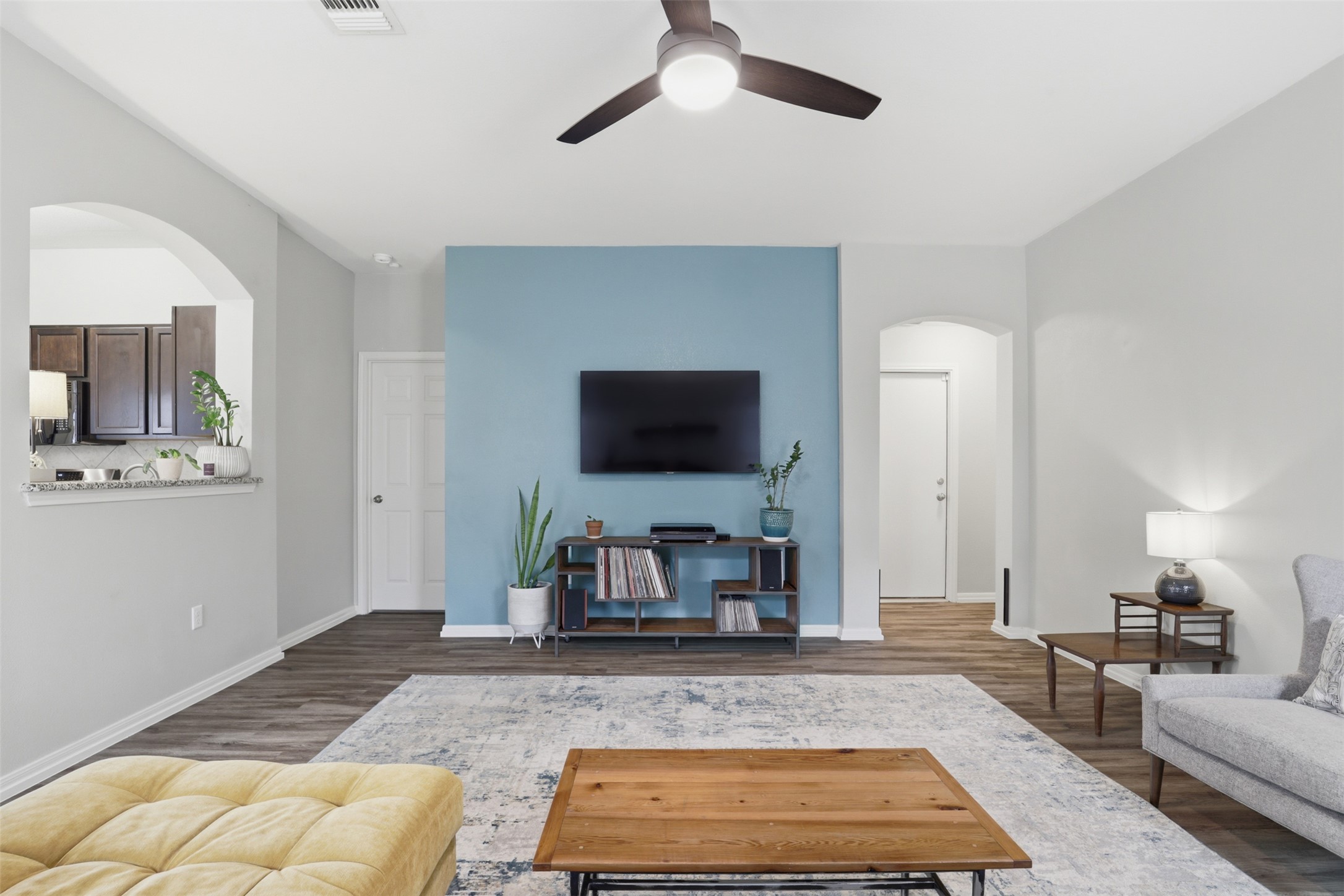 13804 Sierra Wind Lane Elgin, TX 78621 - Photo 7 of 29 a living room with furniture and a flat screen tv