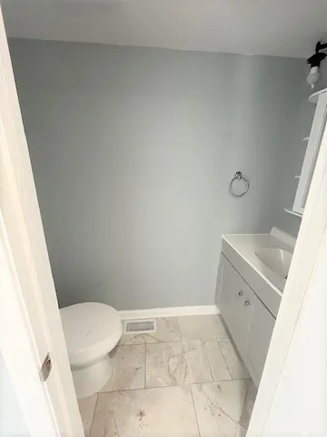 a bathroom with a sink and a toilet