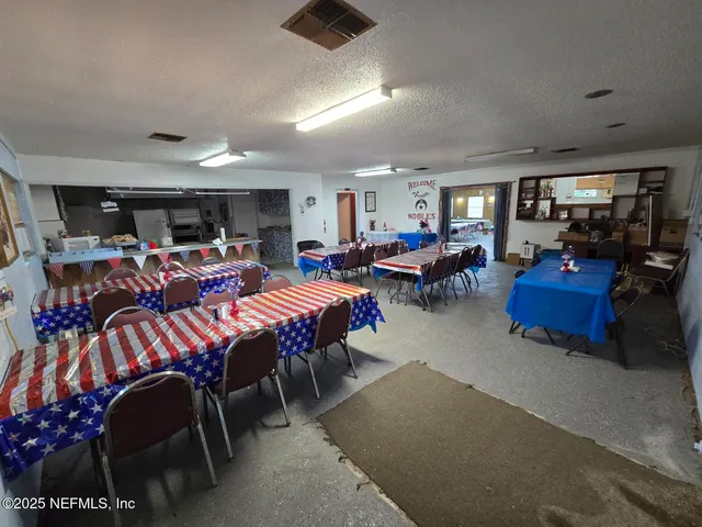 a very nice looking living room with furniture and a large window