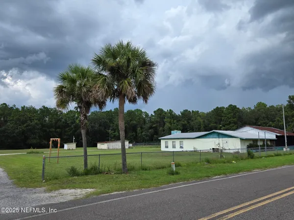 a view of a park with palm trees
