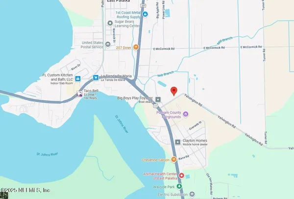 a view of a swimming pool with a hallway and stairs