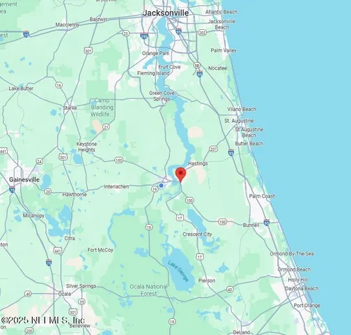 a white bath tub sitting next to a white door