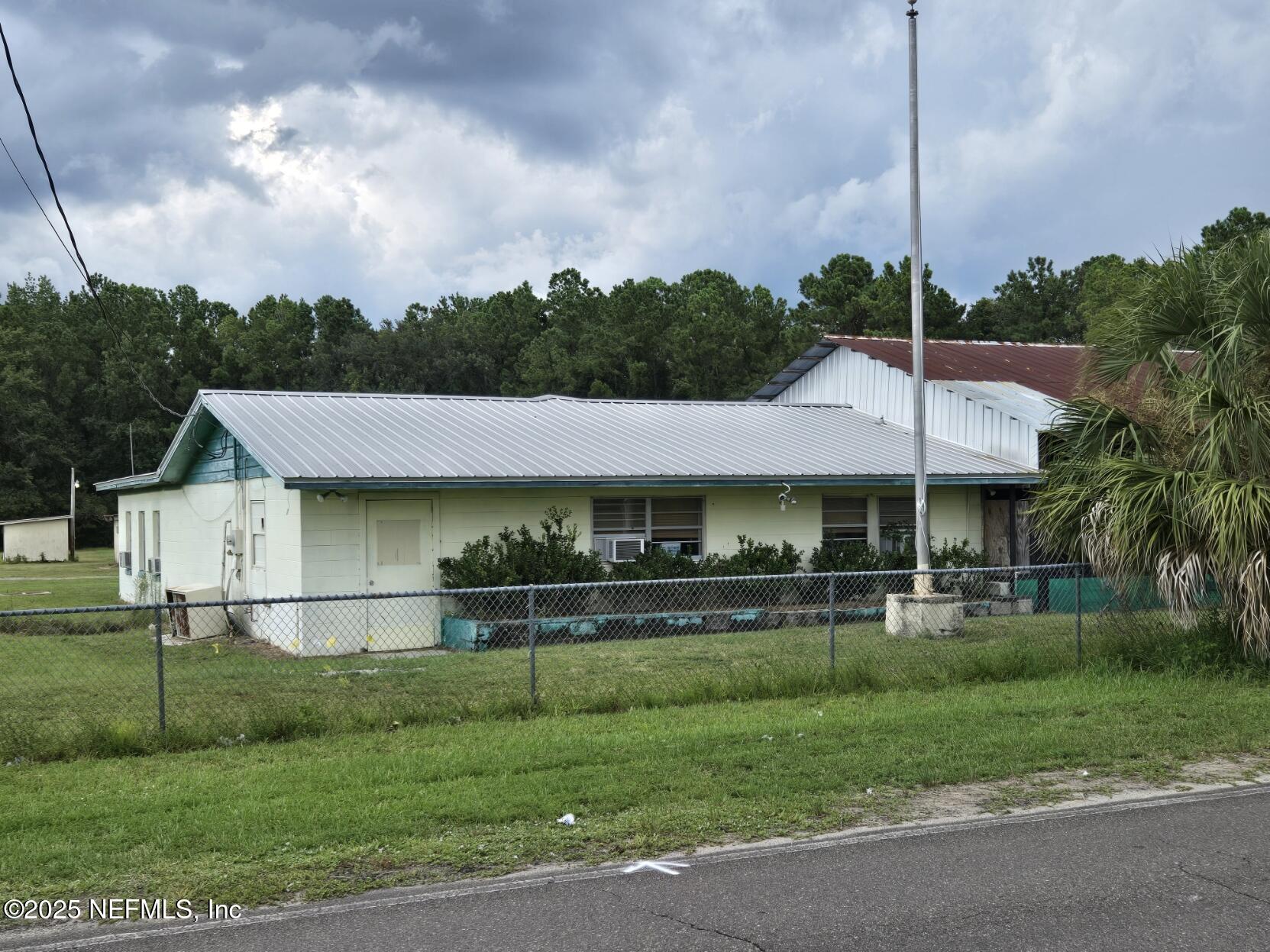 118 Yelvington Road East Palatka, FL 32131 - Photo 7 of 22 a front view of a house with a yard