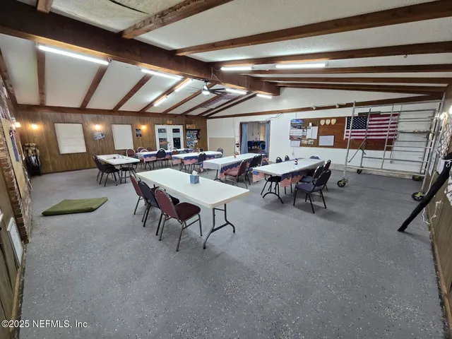 a view of a livingroom with furniture and a window