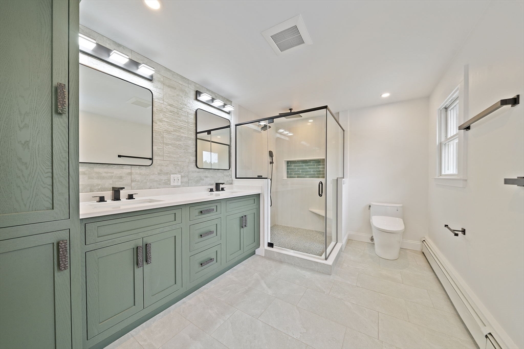 49 Algonquin Road Canton, MA 02021 - Photo 30 of 42 a spacious bathroom with double vanity and a shower