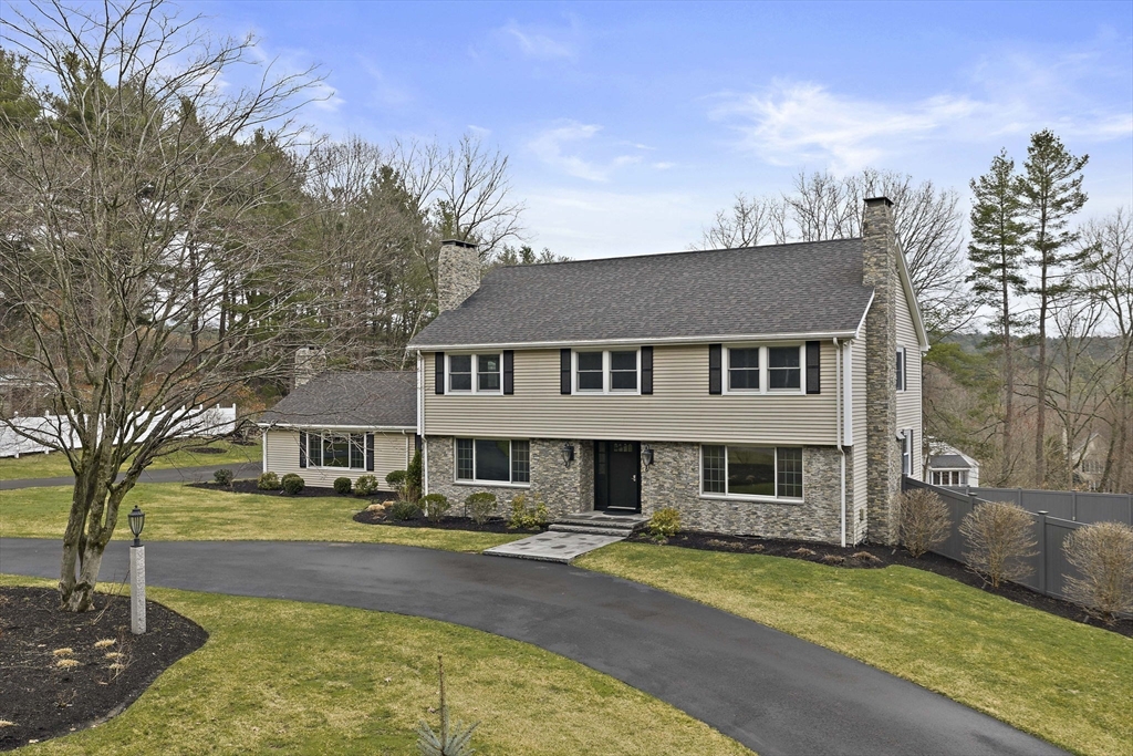 49 Algonquin Road Canton, MA 02021 - Photo 3 of 42 a front view of a residential houses with yard and trees