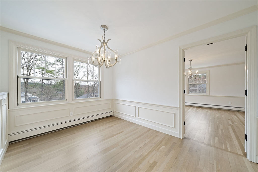 49 Algonquin Road Canton, MA 02021 - Photo 8 of 42 wooden floor in an empty room with a window