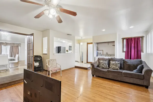 a living room with furniture or couch and a wooden floor