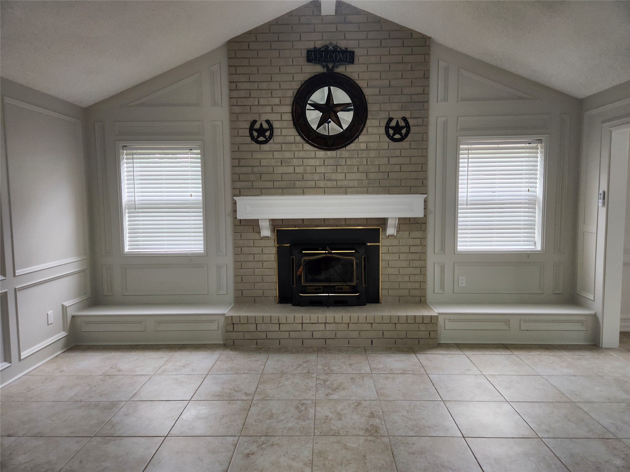 1810 State Highway 150 Coldspring, TX 77331 - Photo 12 of 28 a view of a livingroom with a fireplace and window