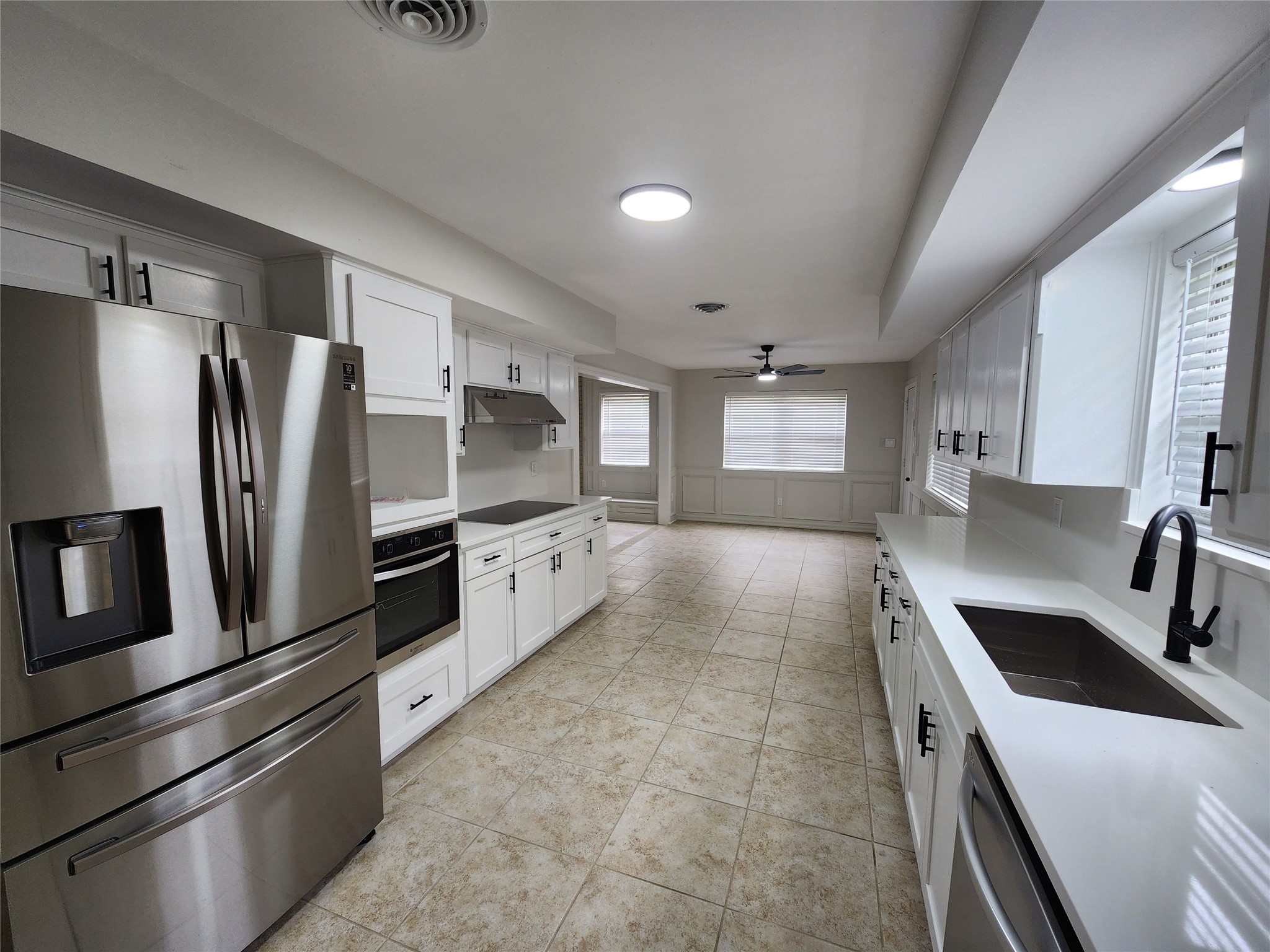 1810 State Highway 150 Coldspring, TX 77331 - Photo 16 of 28 a kitchen with stainless steel appliances a refrigerator sink and stove