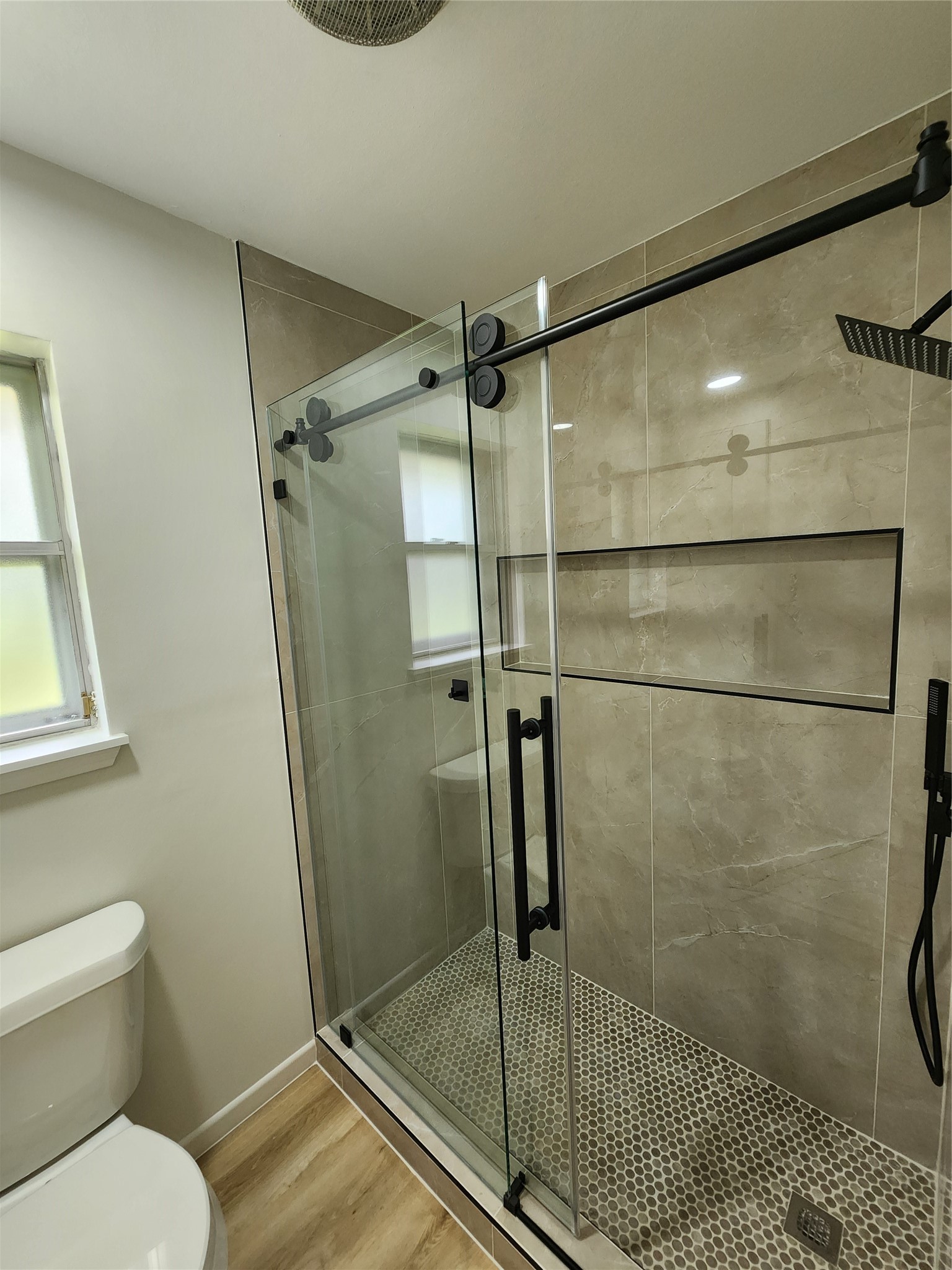 1810 State Highway 150 Coldspring, TX 77331 - Photo 20 of 28 a bathroom with a shower and toilet