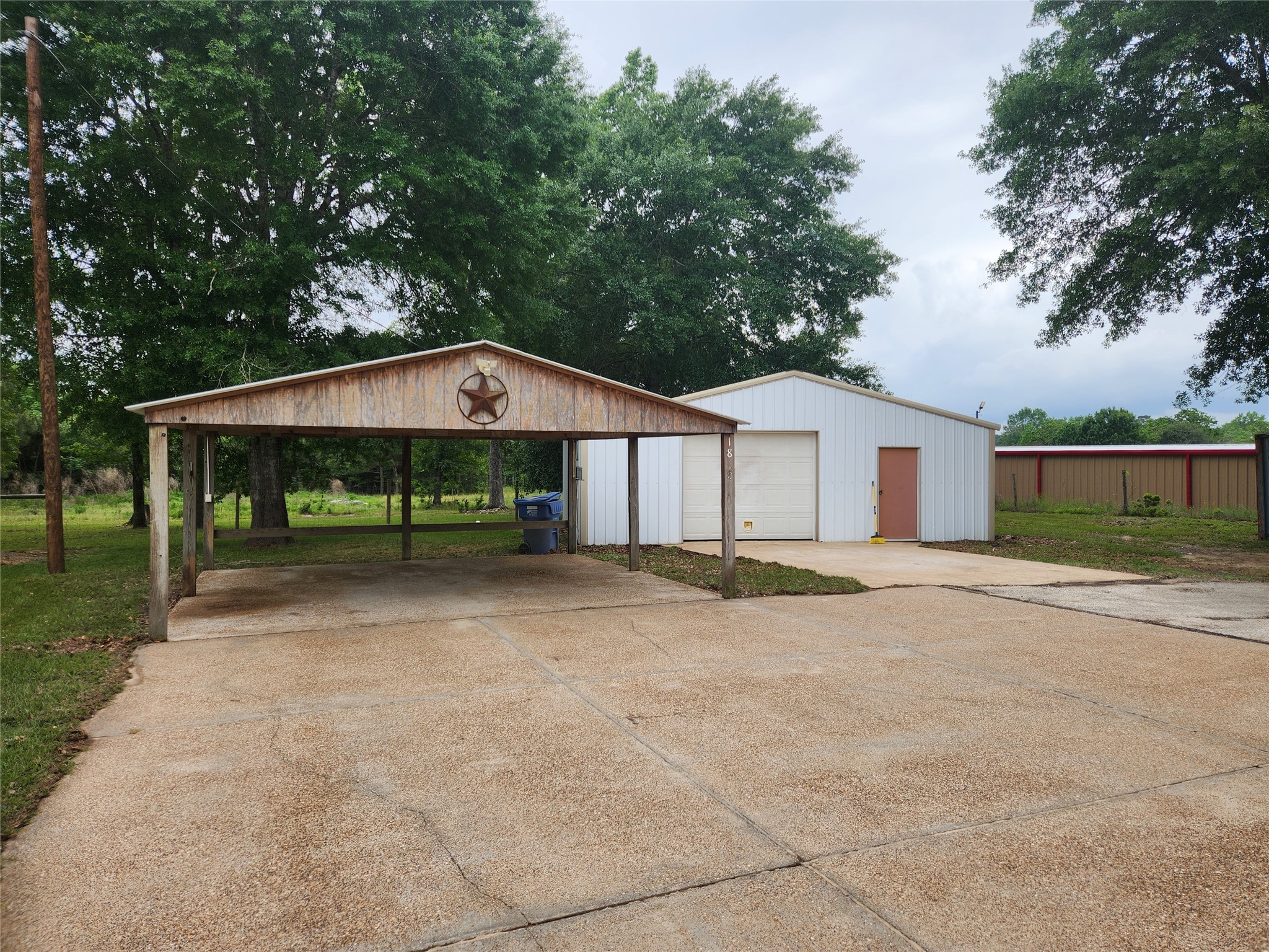 1810 State Highway 150 Coldspring, TX 77331 - Photo 2 of 28 a view of a house with backyard and trees