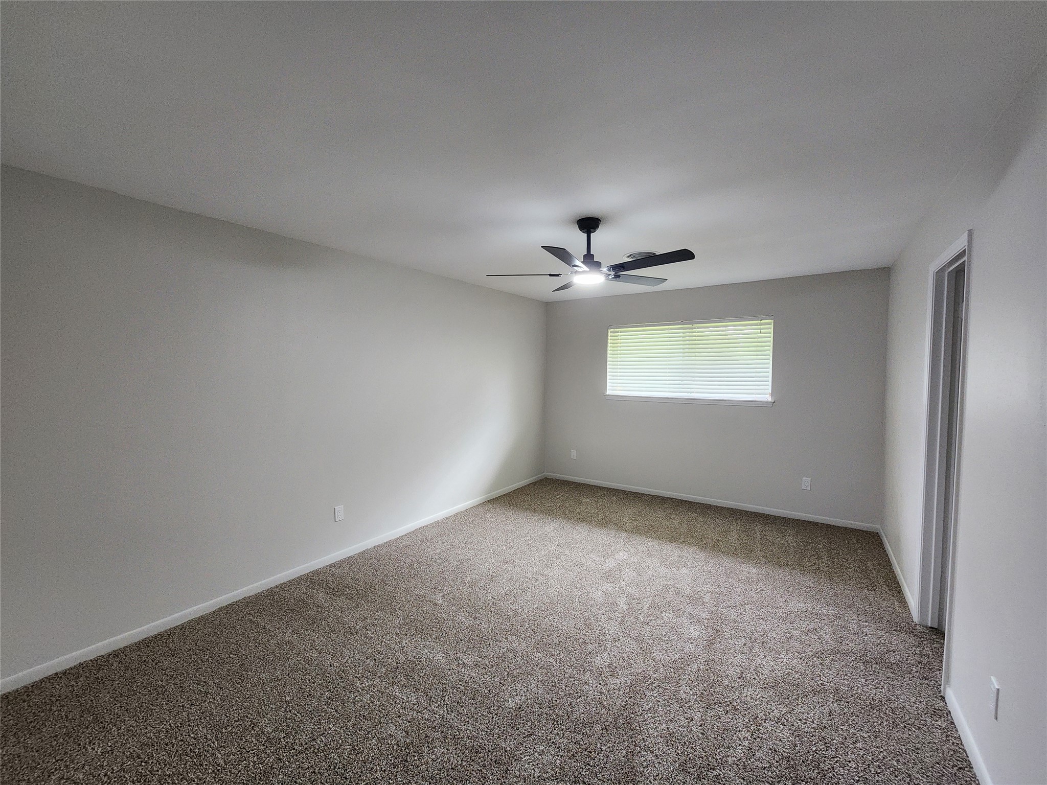 1810 State Highway 150 Coldspring, TX 77331 - Photo 22 of 28 a view of an empty room with a window