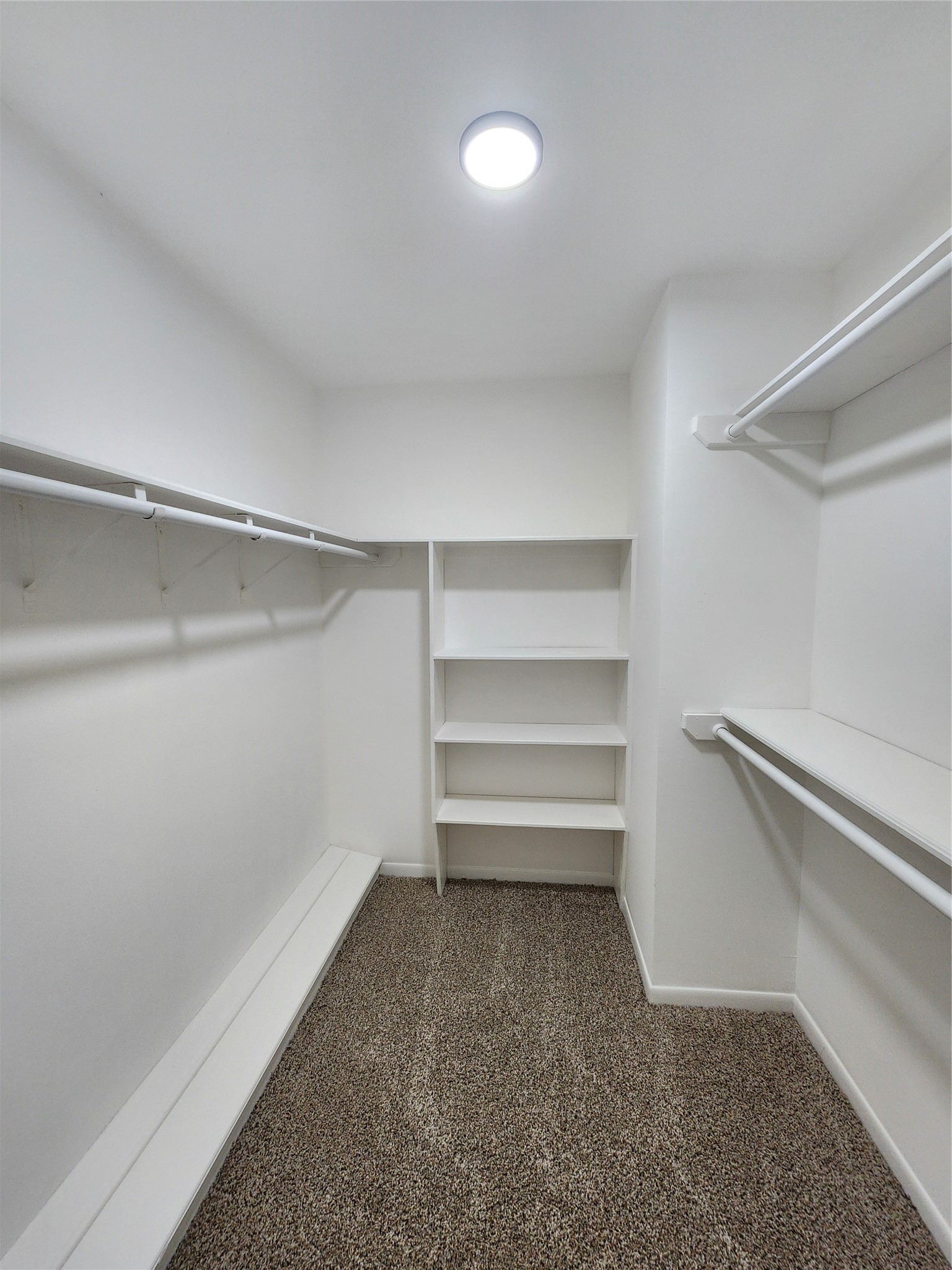 1810 State Highway 150 Coldspring, TX 77331 - Photo 23 of 28 a storage room with empty racks