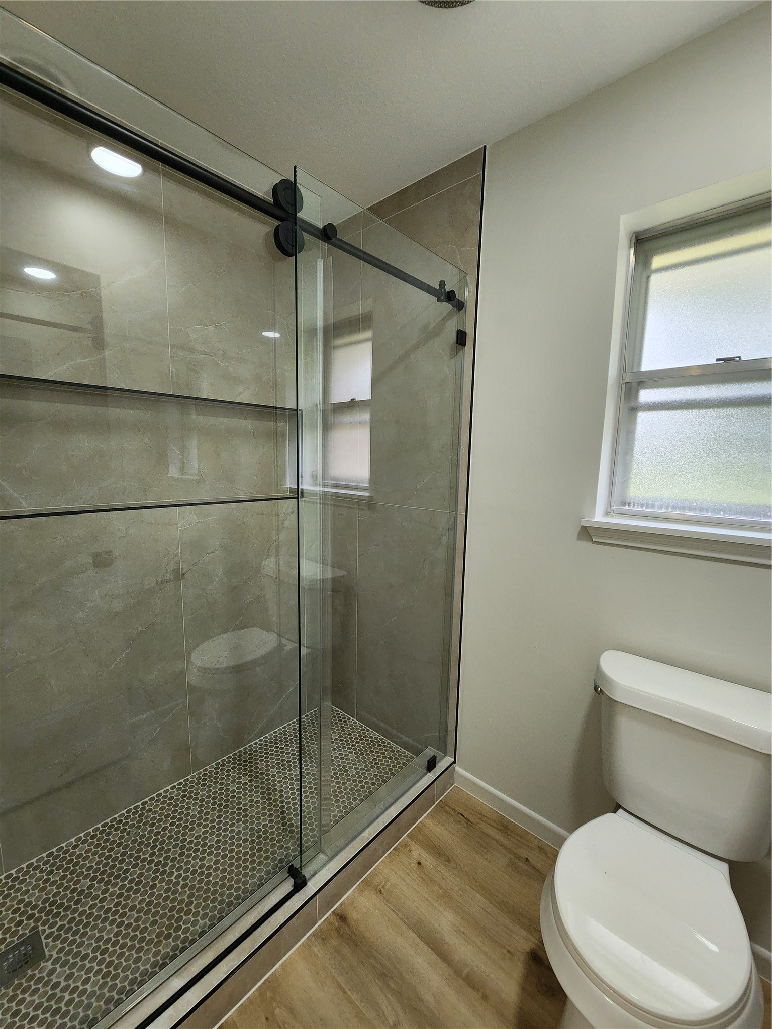 1810 State Highway 150 Coldspring, TX 77331 - Photo 25 of 28 a bathroom with a toilet and a shower