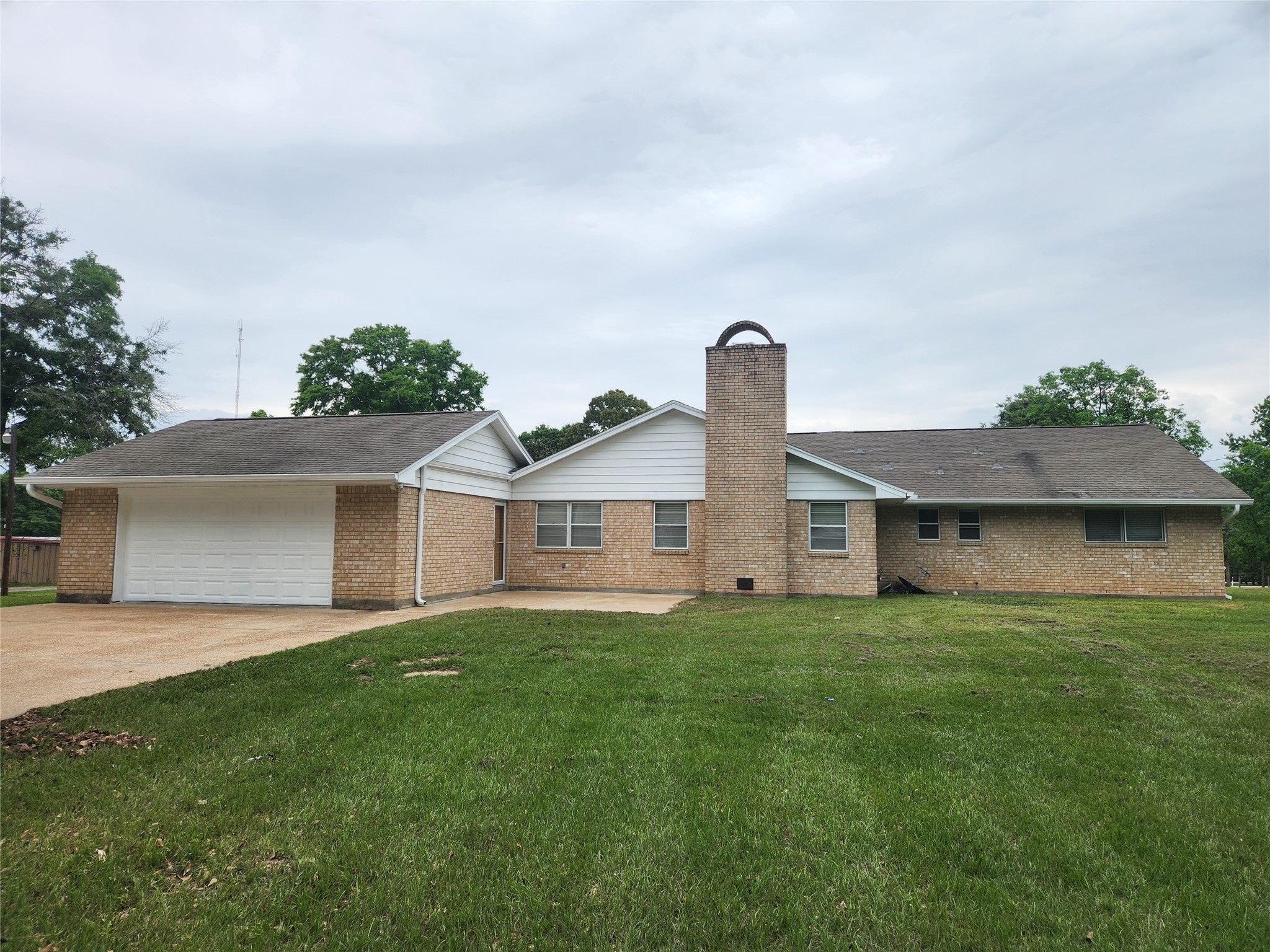 1810 State Highway 150 Coldspring, TX 77331 - Photo 4 of 28 front view of a house with a yard
