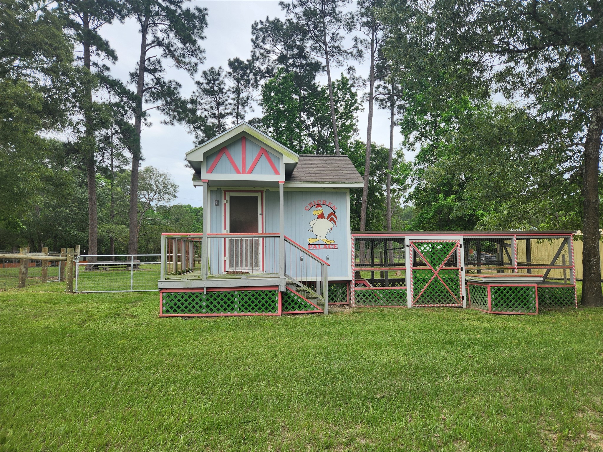 1810 State Highway 150 Coldspring, TX 77331 - Photo 9 of 28 a front view of a house with a yard table and chairs