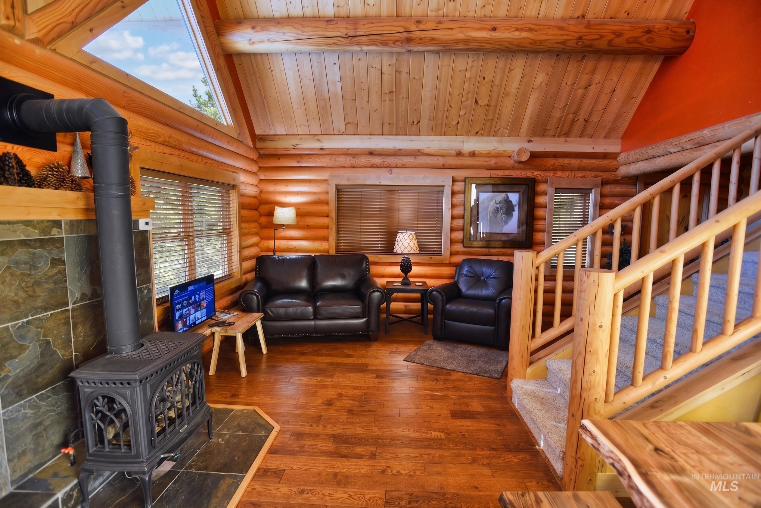 788 Chad Loop McCall, ID 83638 - Photo 4 of 22 Natural wood-paneled walls and ceiling with exposed beams
