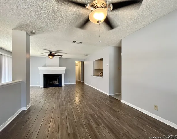 a view of a livingroom with wooden floor