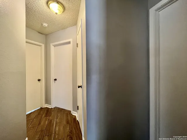 a view of bedroom with a bed and wooden floor