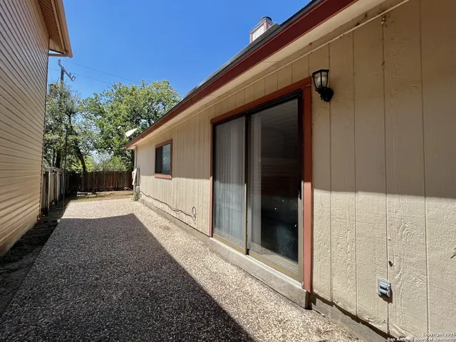 a view of a house with a backyard