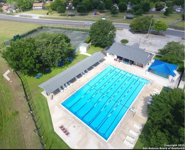 a view of swimming pool with a yard