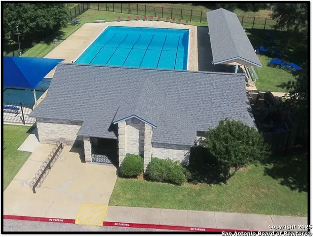a view of a wooden deck and a yard