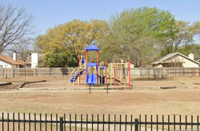 a view of swimming pool with an outdoor seating