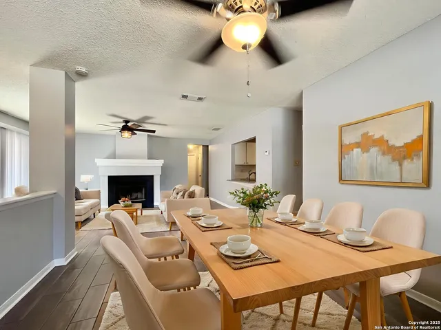 a view of a dining room with furniture wooden floor and chandelier